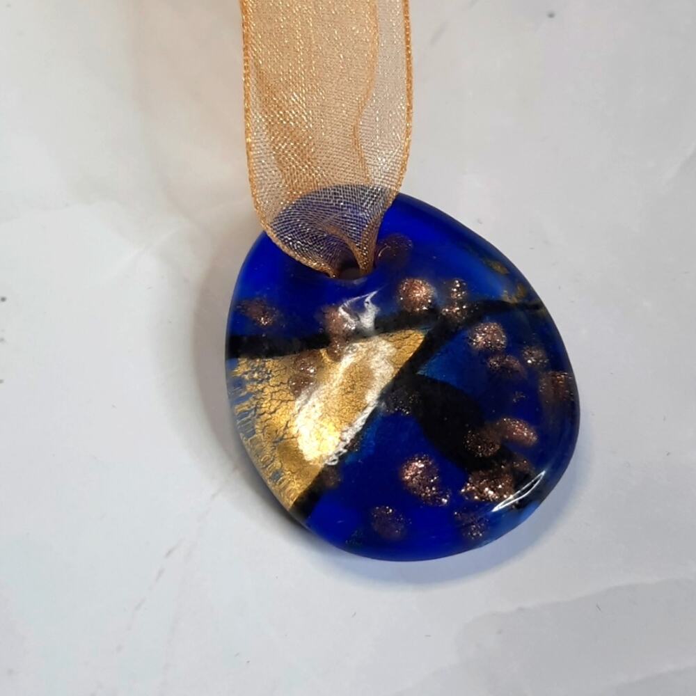 Abstract Blue Pendant On Shimmery Gold Ribbon